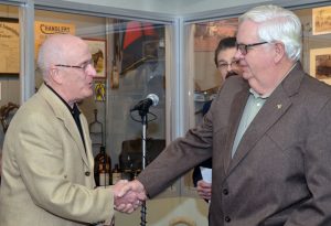 George Buckaloo (left) congratulates Bill Jones after Jones is inducted into the Missouri Veterinary Medical Foundation Honor Roll. MVMF Chairman Phil Brown, DVM, served as the emcee for the ceremony.