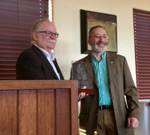 Bryan Slinker, Dean at Washington State University’s College of Veterinary Medicine, presents John Middleton with the college’s Distinguished Veterinary Alumni Award.