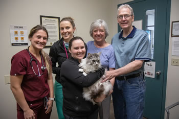 From left: VM4 Jessica Taylor, Ashton Story, Malissa Hoehn, Judy Williams and Tom Williams pose with Nora.